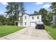 Charming two-story home featuring a covered porch, attached garage, and well-manicured lawn at 2670 Trotters Pointe Drive Dr, Snellville, GA 30039