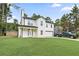 Charming two-story home featuring a covered porch, attached garage, and well-manicured lawn at 2670 Trotters Pointe Drive Dr, Snellville, GA 30039