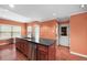 Modern kitchen island features a stainless steel dishwasher and dark countertops at 2670 Trotters Pointe Drive Dr, Snellville, GA 30039