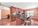 Kitchen with dark hardwood cabinets and flooring, granite countertops, island and modern appliances at 2670 Trotters Pointe Drive Dr, Snellville, GA 30039