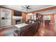 Cozy living room featuring a fireplace, built-in shelves, and hardwood floors at 2670 Trotters Pointe Drive Dr, Snellville, GA 30039