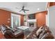 Cozy living room featuring a fireplace, hardwood floors, and ceiling fan at 2670 Trotters Pointe Drive Dr, Snellville, GA 30039
