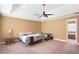Large main bedroom featuring a ceiling fan and two twin beds with neutral tan walls at 2670 Trotters Pointe Drive Dr, Snellville, GA 30039