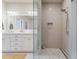 Bright bathroom featuring double vanity, white cabinetry, and a spacious glass-enclosed shower at 328 Stonemont Dr, Atlanta, GA 30305