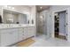 Bright bathroom featuring a double vanity and walk-in shower at 328 Stonemont Dr, Atlanta, GA 30305