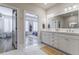 Bright bathroom featuring a double vanity and marble floors at 328 Stonemont Dr, Atlanta, GA 30305