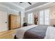 Bedroom features an armoire and plantation shutters at 328 Stonemont Dr, Atlanta, GA 30305