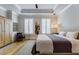 Bright bedroom featuring tray ceilings, hardwood floors and plantation shutters at 328 Stonemont Dr, Atlanta, GA 30305