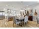 Dining area with hardwood floors, a dining table, and an island at 328 Stonemont Dr, Atlanta, GA 30305