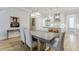 This dining room showcases hardwood floors, modern lighting, and an open floor plan leading to the kitchen at 328 Stonemont Dr, Atlanta, GA 30305