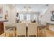 This dining room boasts hardwood floors, statement lighting, and neutral tones that create an inviting atmosphere at 328 Stonemont Dr, Atlanta, GA 30305