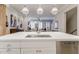 This gourmet kitchen boasts an island with seating and a view into a nearby sitting room at 328 Stonemont Dr, Atlanta, GA 30305