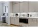 This kitchen features custom cabinetry, modern appliances, a wine cooler, and ample counter space at 328 Stonemont Dr, Atlanta, GA 30305