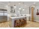 This gourmet kitchen features a spacious island with seating, custom cabinetry, and stainless steel appliances at 328 Stonemont Dr, Atlanta, GA 30305
