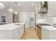 This modern kitchen boasts an island with seating, stainless steel appliances, and an open layout at 328 Stonemont Dr, Atlanta, GA 30305