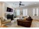 Bright living room featuring a fireplace, hardwood floors, and double doors at 328 Stonemont Dr, Atlanta, GA 30305