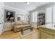 Living room with hardwood floors, plantation shutters, and decorative furnishings at 328 Stonemont Dr, Atlanta, GA 30305