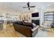 Spacious living room featuring an open floor plan, fireplace, and views of the kitchen at 328 Stonemont Dr, Atlanta, GA 30305