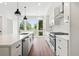 Bright kitchen with stainless appliances, white cabinets, and a large window at 1631 Overlook Nw Way # 2, Atlanta, GA 30318