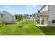 Expansive backyard showing green lawn, modern exteriors, and well-maintained landscaping at 13568 Whitman Lane, Covington, GA 30014