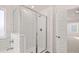 Bright bathroom with a glass-enclosed shower with subway tile and a view of the bedroom at 13568 Whitman Lane, Covington, GA 30014