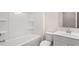 Bright bathroom featuring a shower and bathtub combination plus a single sink vanity at 13568 Whitman Lane, Covington, GA 30014