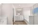 Bright bathroom featuring a shower, bathtub combination plus double sink vanities at 13568 Whitman Lane, Covington, GA 30014