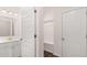 Bathroom with gold fixtures, storage, and a hall tree in the entryway at 13568 Whitman Lane, Covington, GA 30014