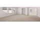 Bright bedroom with neutral carpet, three windows, and a closet with double doors at 13568 Whitman Lane, Covington, GA 30014