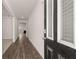 Inviting home entryway with hardwood floors and neutral walls leading to a bright, open living space at 13568 Whitman Lane, Covington, GA 30014