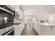 Modern kitchen with stainless appliances, double oven, and a large central island at 13568 Whitman Lane, Covington, GA 30014