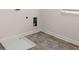 Bright laundry room features durable flooring, clean white walls, and modern hookups at 13568 Whitman Lane, Covington, GA 30014
