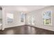 Bright living room with hardwood floors, white walls, natural light and access to the outside at 13568 Whitman Lane, Covington, GA 30014