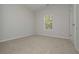Bedroom featuring neutral carpet, natural light and doors in the background at 500 Charleston Pl, Villa Rica, GA 30180