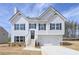 Charming two-story home with white siding, black shutters, and an attached two car garage at 500 Charleston Pl, Villa Rica, GA 30180