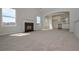 Open living room with fireplace, large windows and neutral walls, showcasing an inviting atmosphere at 500 Charleston Pl, Villa Rica, GA 30180