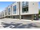 Modern townhome exteriors with gray siding, black garage doors and large windows at 1633 Overlook Nw Way # 3, Atlanta, GA 30318