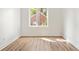This bedroom features hardwood floors, and a large window with natural light at 1641 Overlook Nw Way # 7, Atlanta, GA 30318