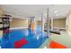 Spacious basement featuring sturdy columns, a blue floor with red accents, and easy access to stairs at 2166 Tanglewood Dr, Snellville, GA 30078