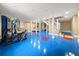 Basement has a blue floor with red accents, and easy access to stairs at 2166 Tanglewood Dr, Snellville, GA 30078