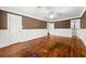 Bedroom offers neutral color palette, hardwood floors, and natural light coming through windows at 2166 Tanglewood Dr, Snellville, GA 30078
