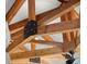 Exposed wooden ceiling beams with black metal connectors at 2166 Tanglewood Dr, Snellville, GA 30078