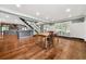 Open-concept dining room with hardwood floors and an adjacent kitchen area at 2166 Tanglewood Dr, Snellville, GA 30078