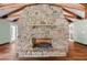 Rustic stone fireplace with a mantle, perfect for cozy evenings at 2166 Tanglewood Dr, Snellville, GA 30078