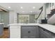 Kitchen island with white countertop and stainless sink at 2166 Tanglewood Dr, Snellville, GA 30078