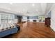 Spacious living room boasts hardwood floors, fireplace, and natural light from large windows and doors at 2166 Tanglewood Dr, Snellville, GA 30078