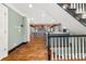 View of the living room featuring the staircase and stone fireplace feature at 2166 Tanglewood Dr, Snellville, GA 30078