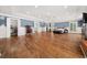 Expansive main bedroom featuring hardwood floors, tray ceilings, and ample natural light from large windows at 2166 Tanglewood Dr, Snellville, GA 30078