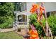 Charming porch with stone flooring, comfortable seating, and lush greenery, creating a relaxing atmosphere at 2166 Tanglewood Dr, Snellville, GA 30078