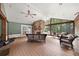 Inviting screened porch with stone fireplace and comfortable seating at 2166 Tanglewood Dr, Snellville, GA 30078